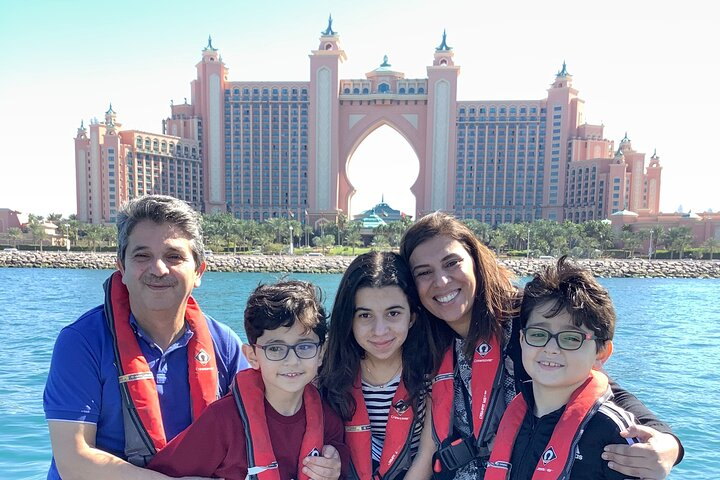 Create lasting memories as you explore Dubai’s stunning skyline with iconic landmarks like the Atlantis in the backdrop. Enjoy fun moments and picturesque views on your adventure!